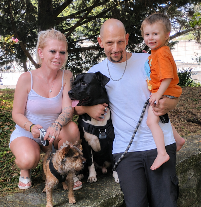 Kristine with her family and dogs at the park